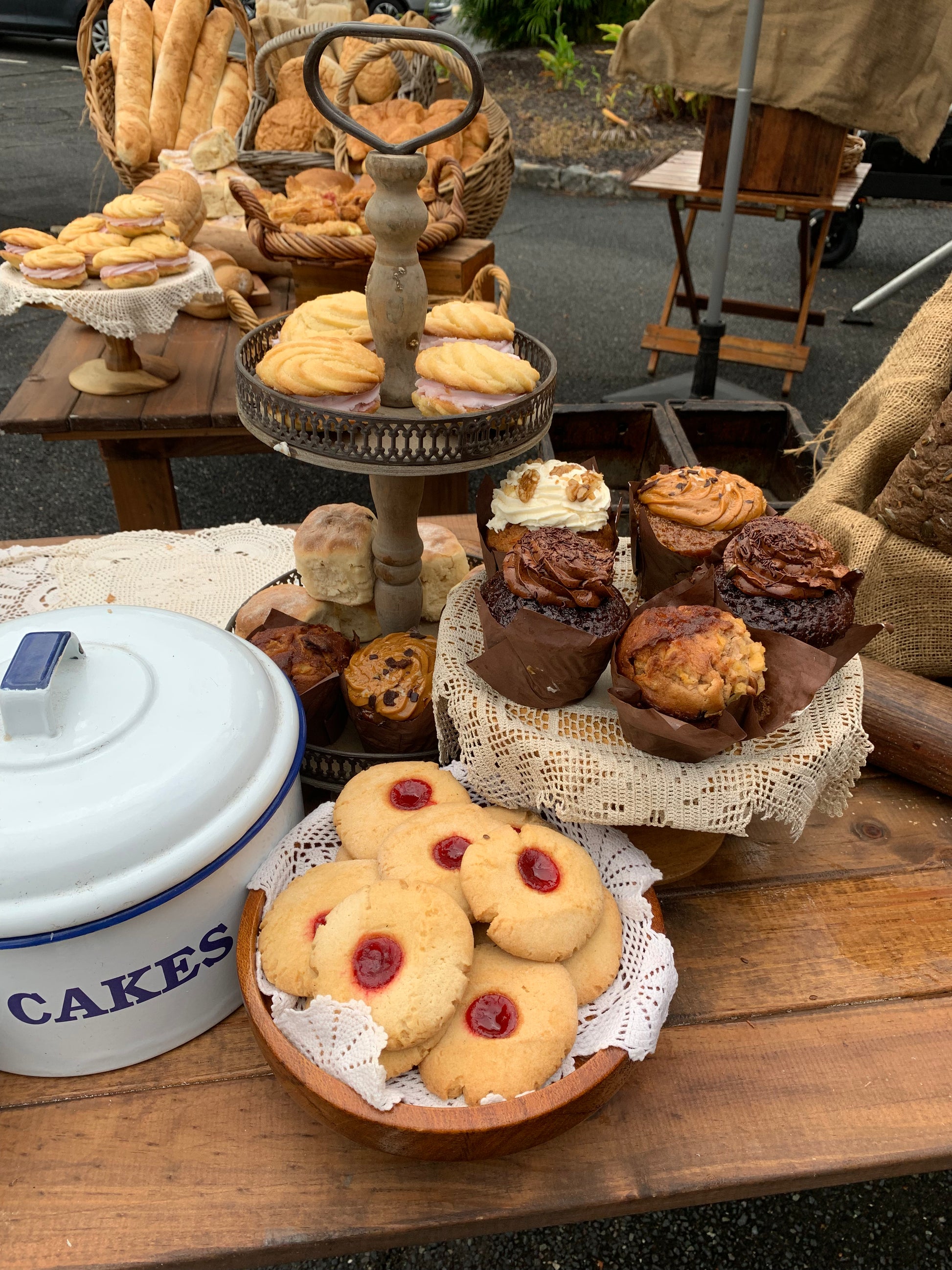 2 tier wood cake stand, enamel cake tin, wood cake stands, baskets, trestle tables, umbrellas, vintage rolling pins, food prop hire, Rockhampton Vintage Hire